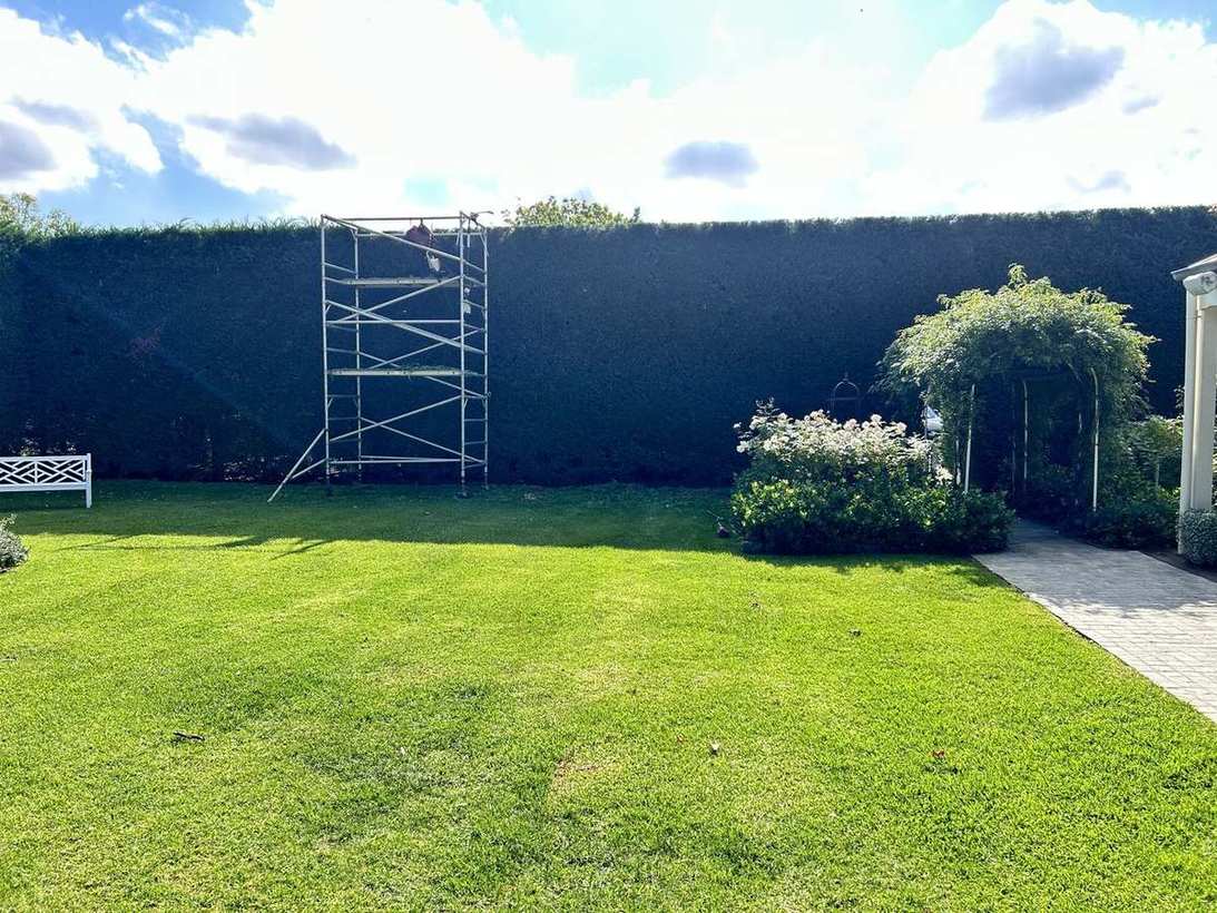 Formal garden hedge — scaffolding work
