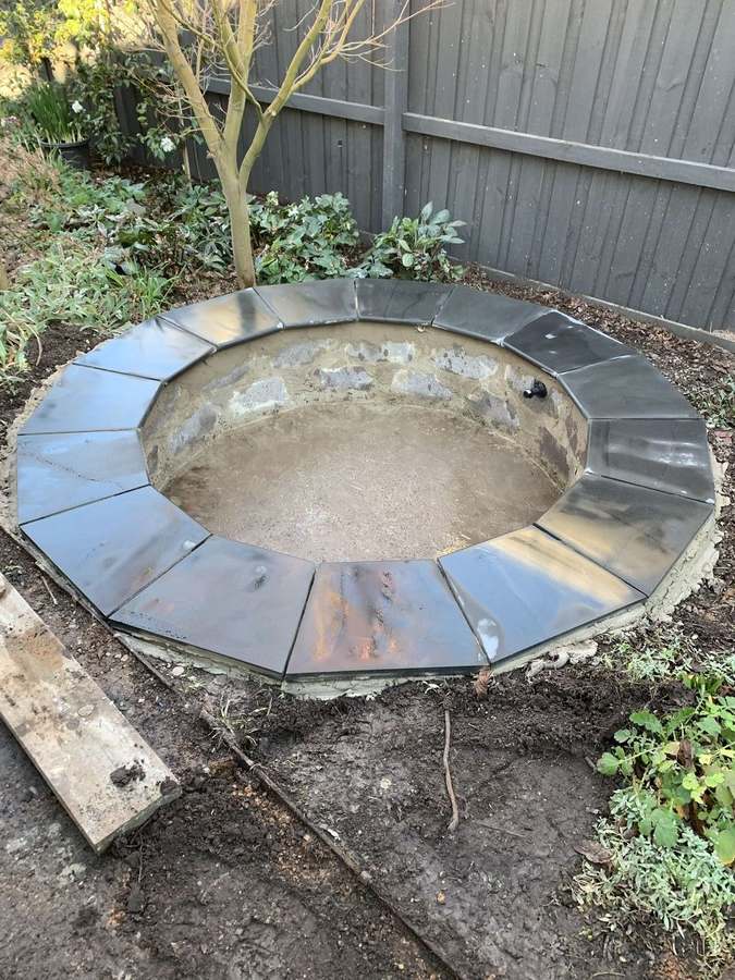 Pond construction — bluestone coping fitted