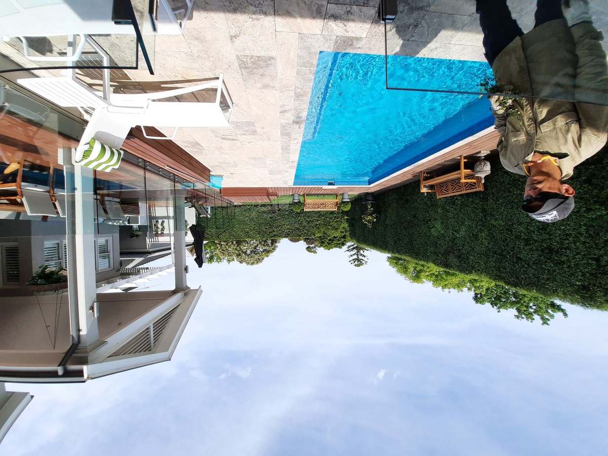 Pool garden maintenance — travertine surrounds