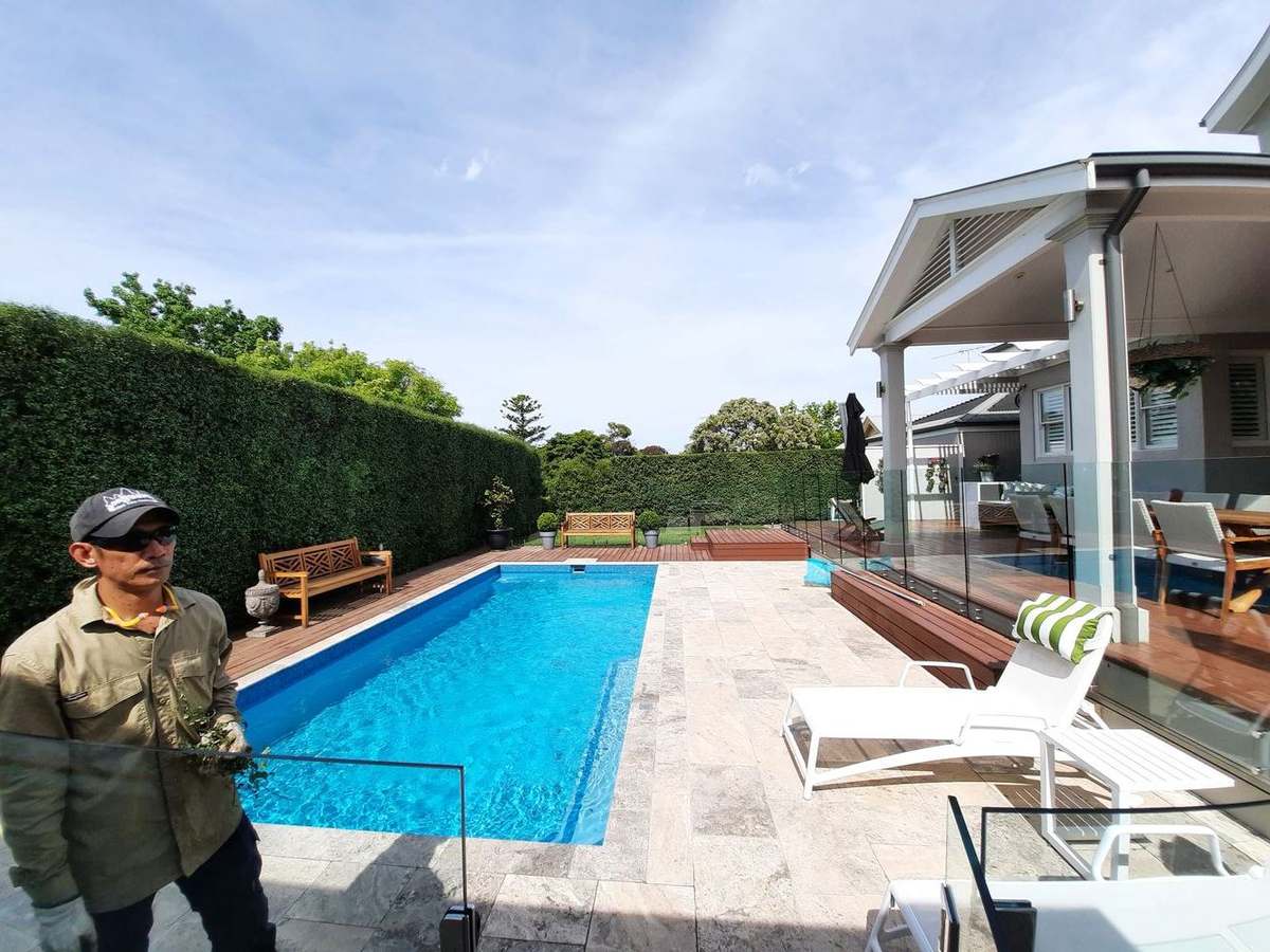 Pool garden maintenance — travertine surrounds